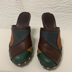 Coach patch work leather & wood mules.